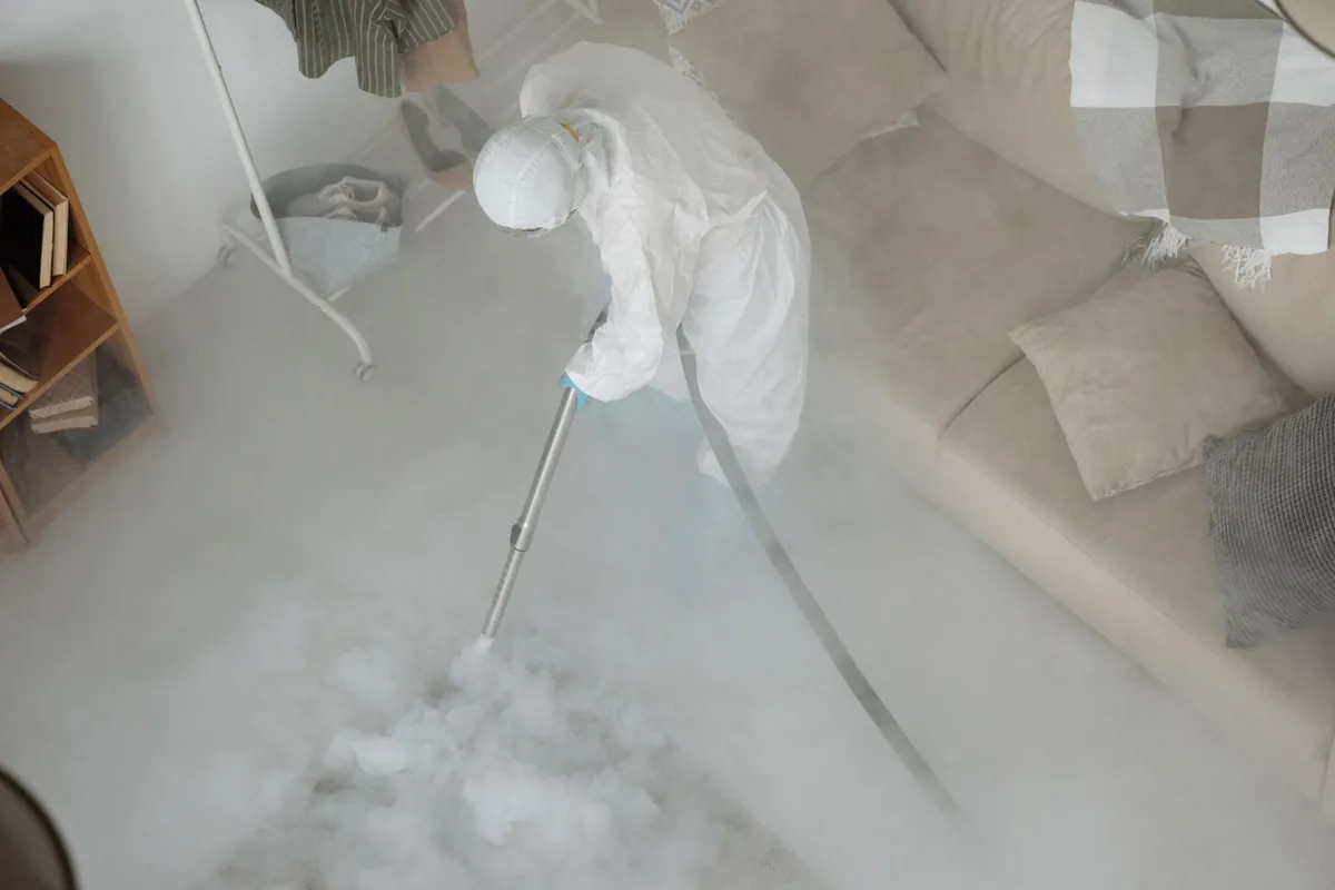 Biohazard cleanup technician in protective equipment, Jackson, AL